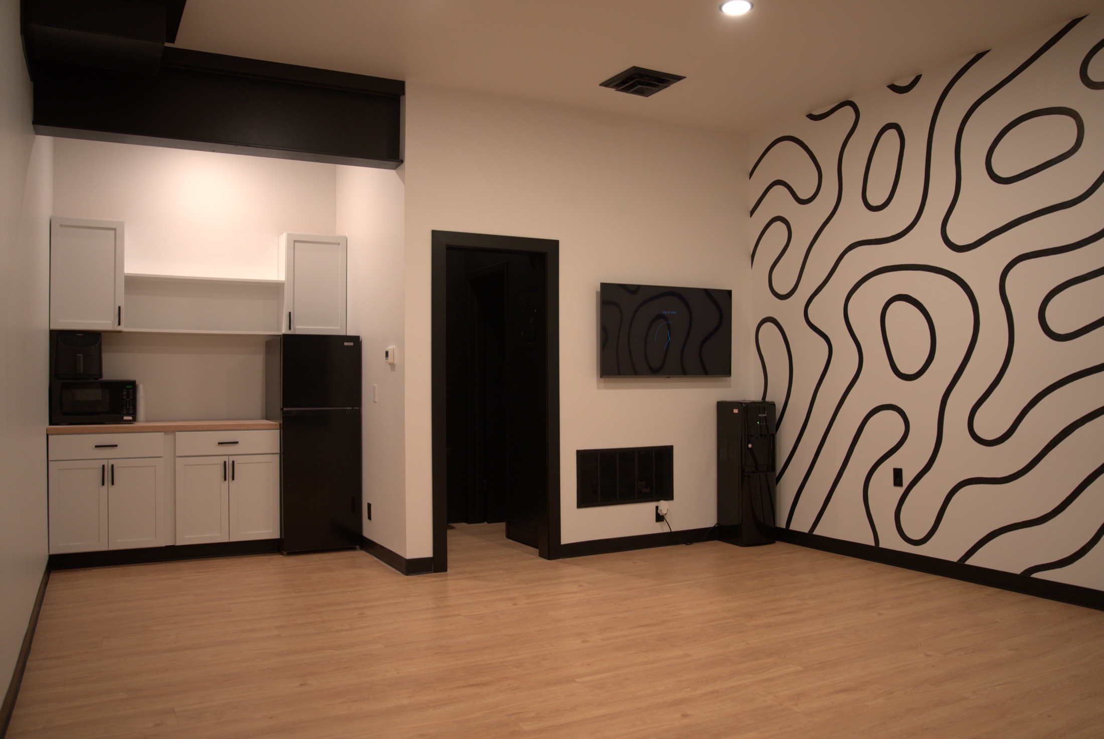 Kitchen and signature wall in the lounge