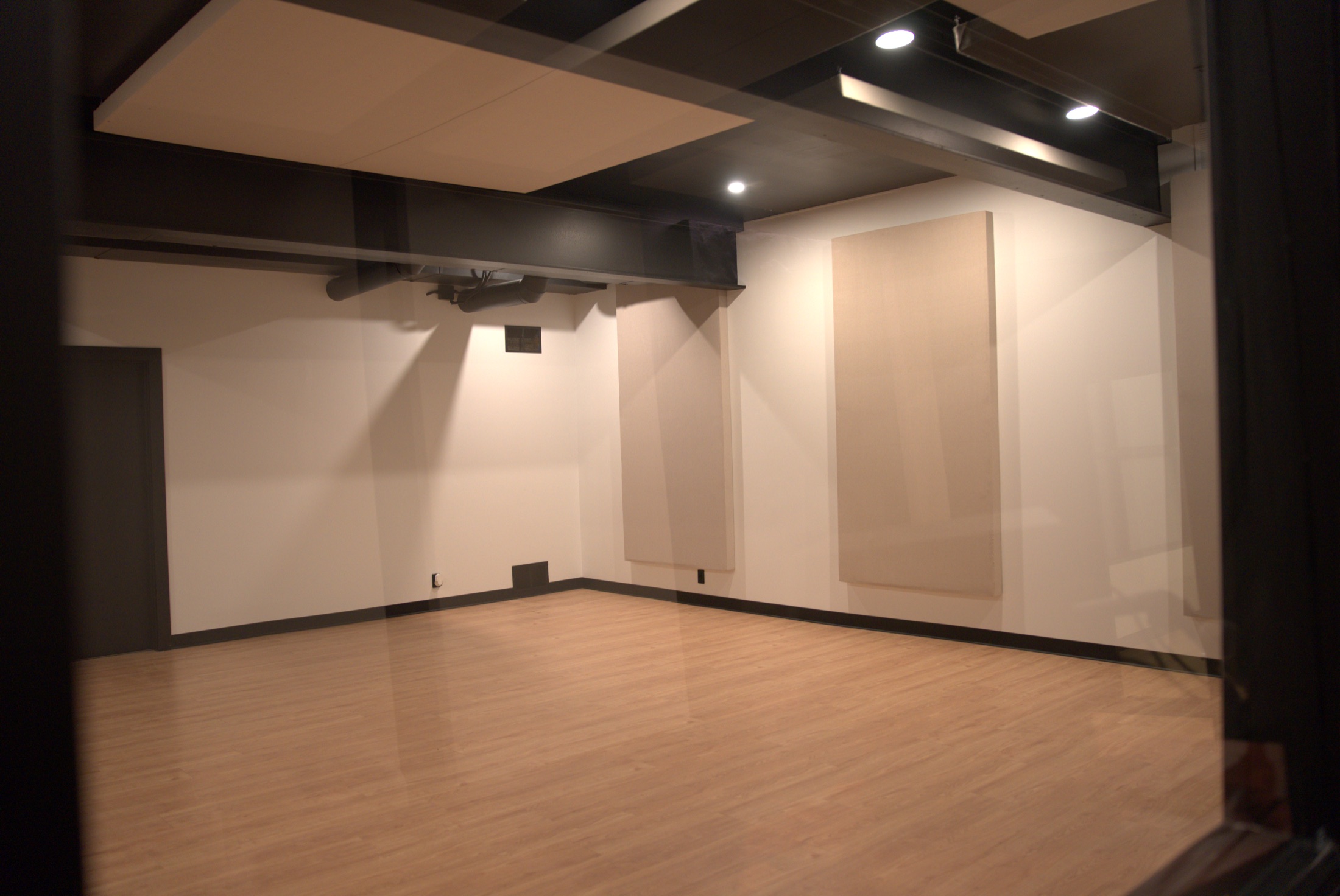 Tracking room viewed through control-room glass